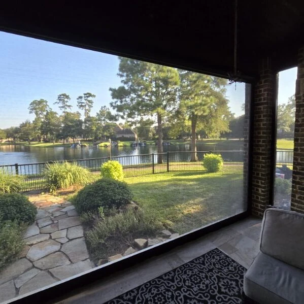 Retractable patio shade keeping mosquitoes off a Houston patio