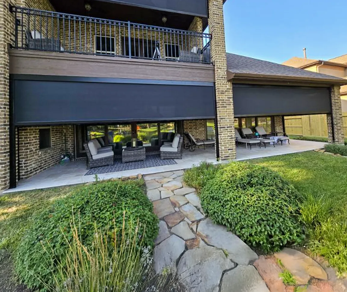 Retractable motorized patio screen on a Houston home