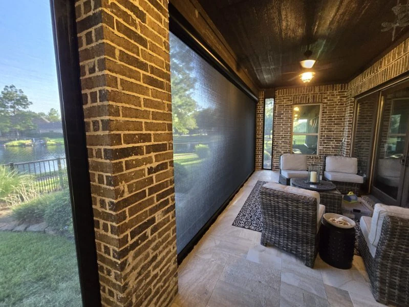 Motorized awning providing shade over a backyard patio
