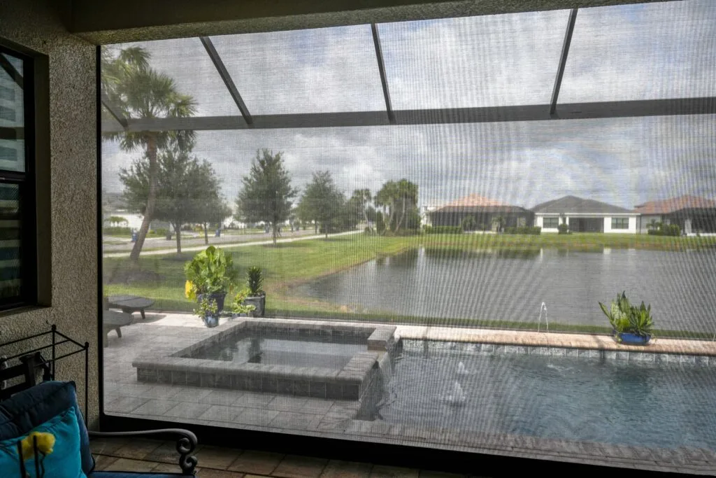 Motorized patio screen on a Houston outdoor living room