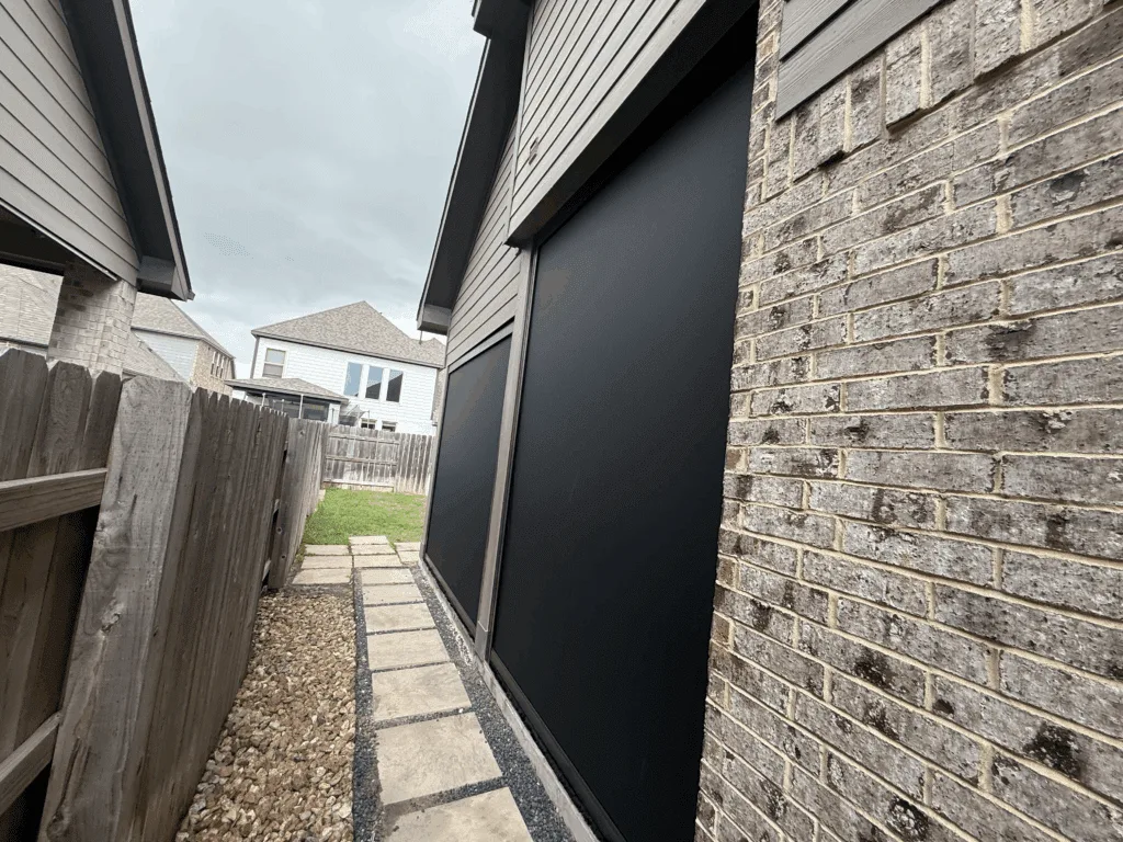 Custom motorized screen on a covered porch