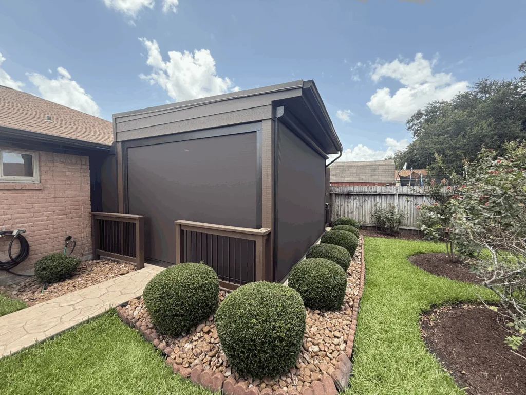 Motorized patio screens enclosing a Houston backyard patio