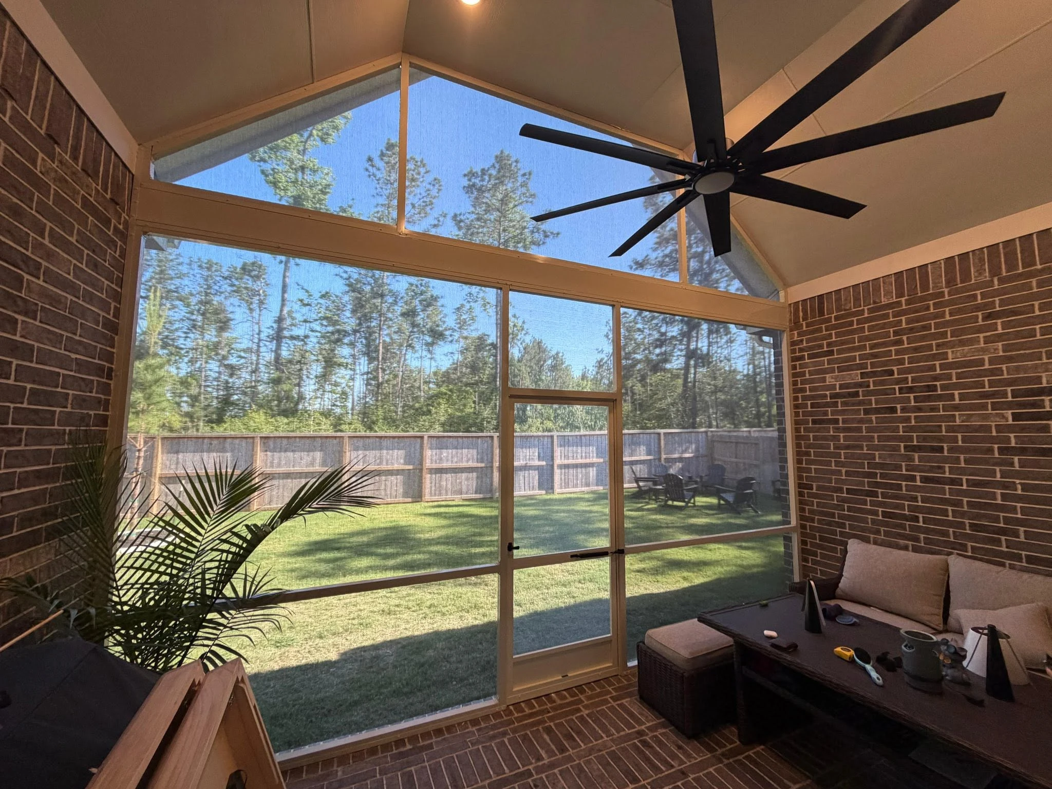 Motorized shade lowered over a Houston patio