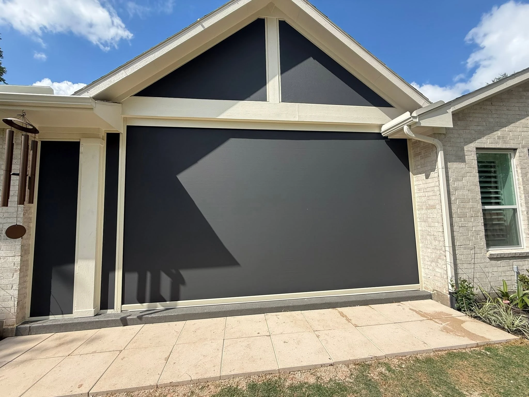 Covered patio enclosed with a custom shade system