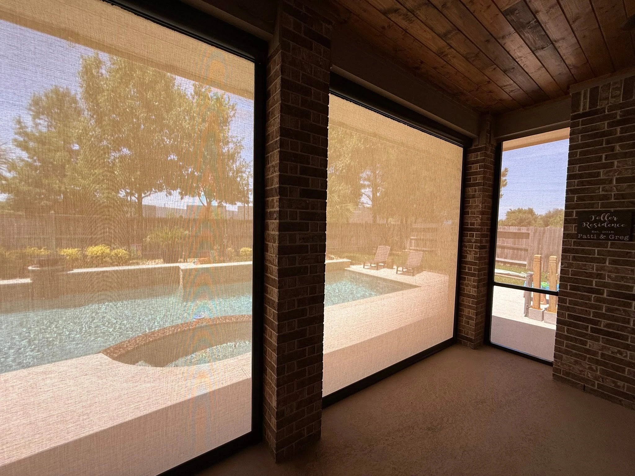 Outdoor living space shaded by a custom patio system