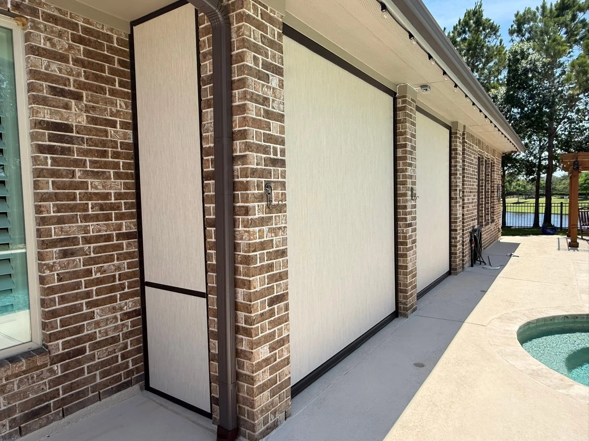 Covered patio enclosed with a custom shade system