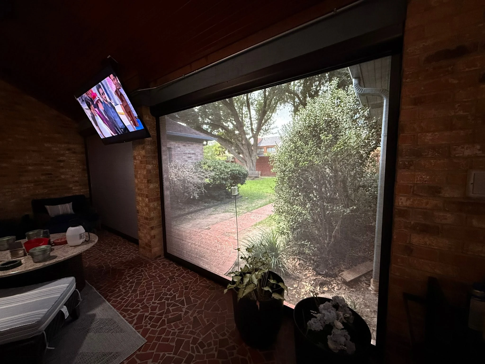 Outdoor living space shaded by a custom patio system