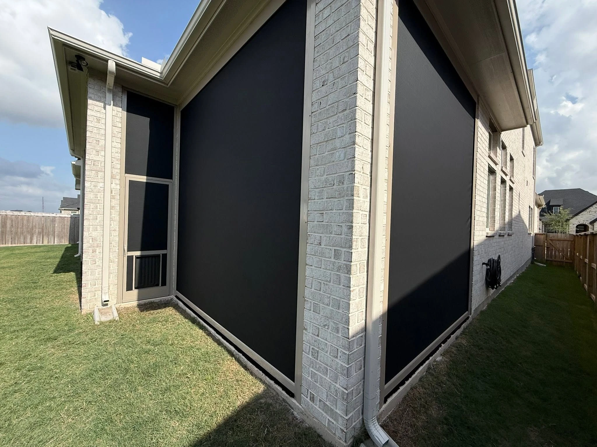 Custom motorized patio screen installation in Houston
