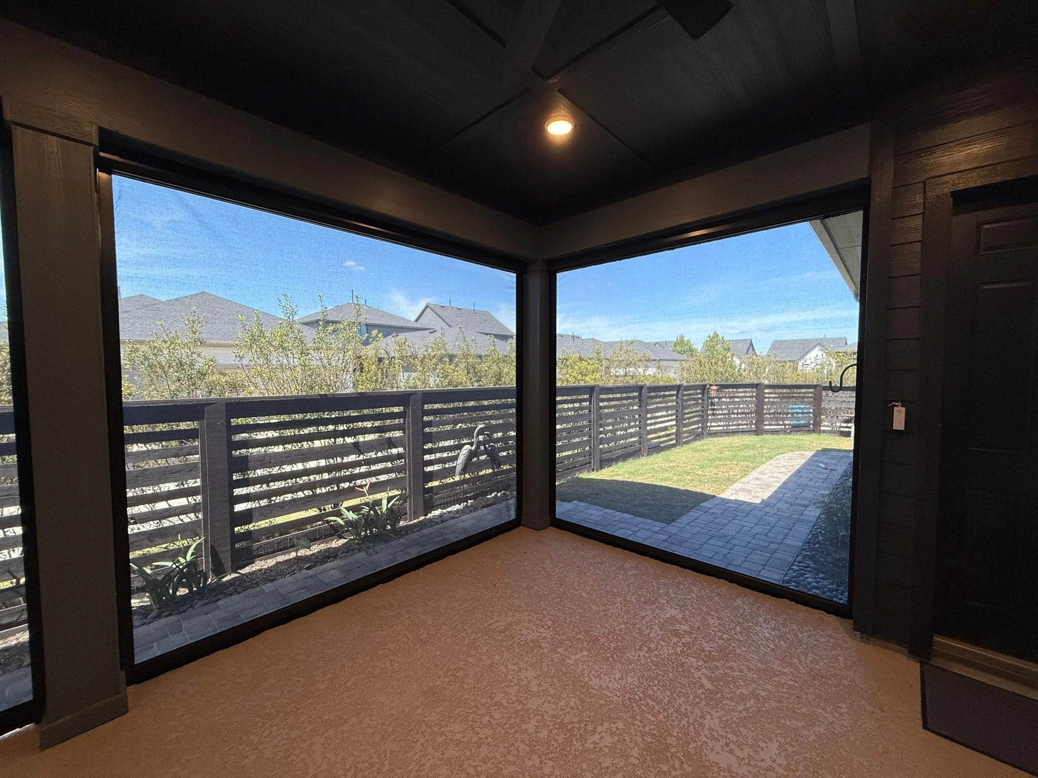 Outdoor living space shaded by a custom patio system