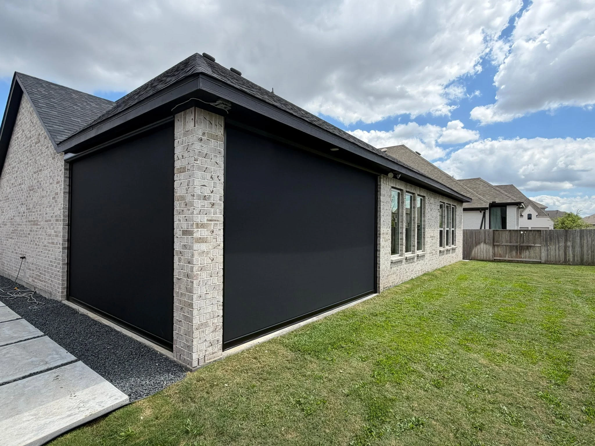 Covered patio enclosed with a custom shade system