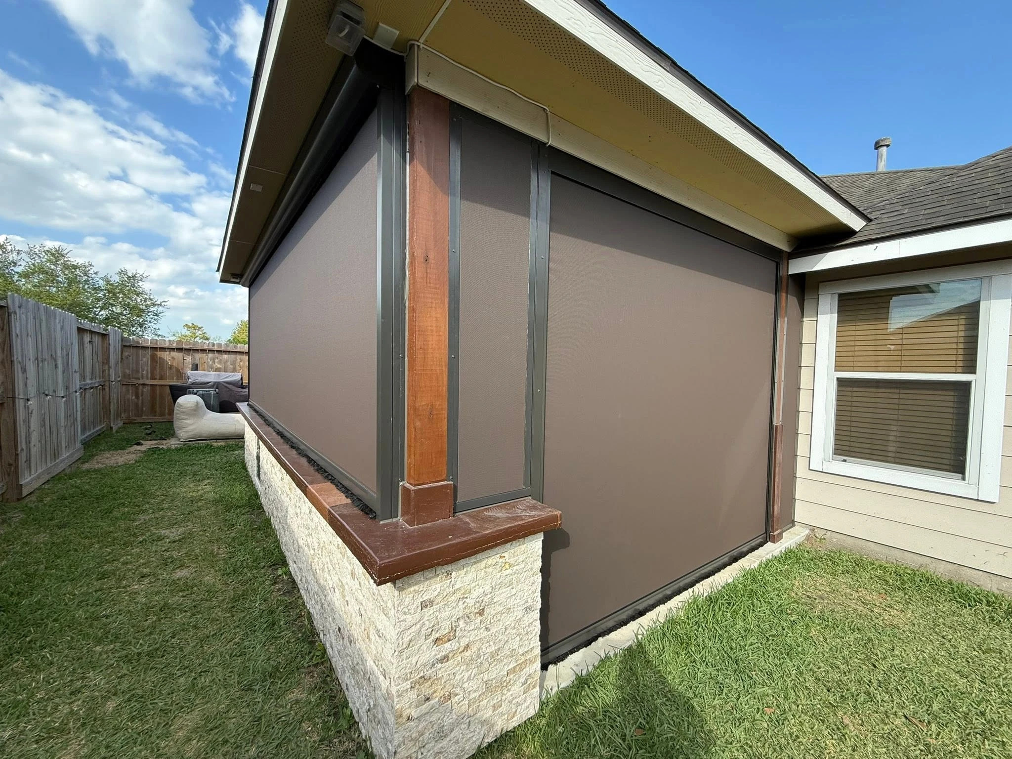 Patio shade system installed on a Houston backyard