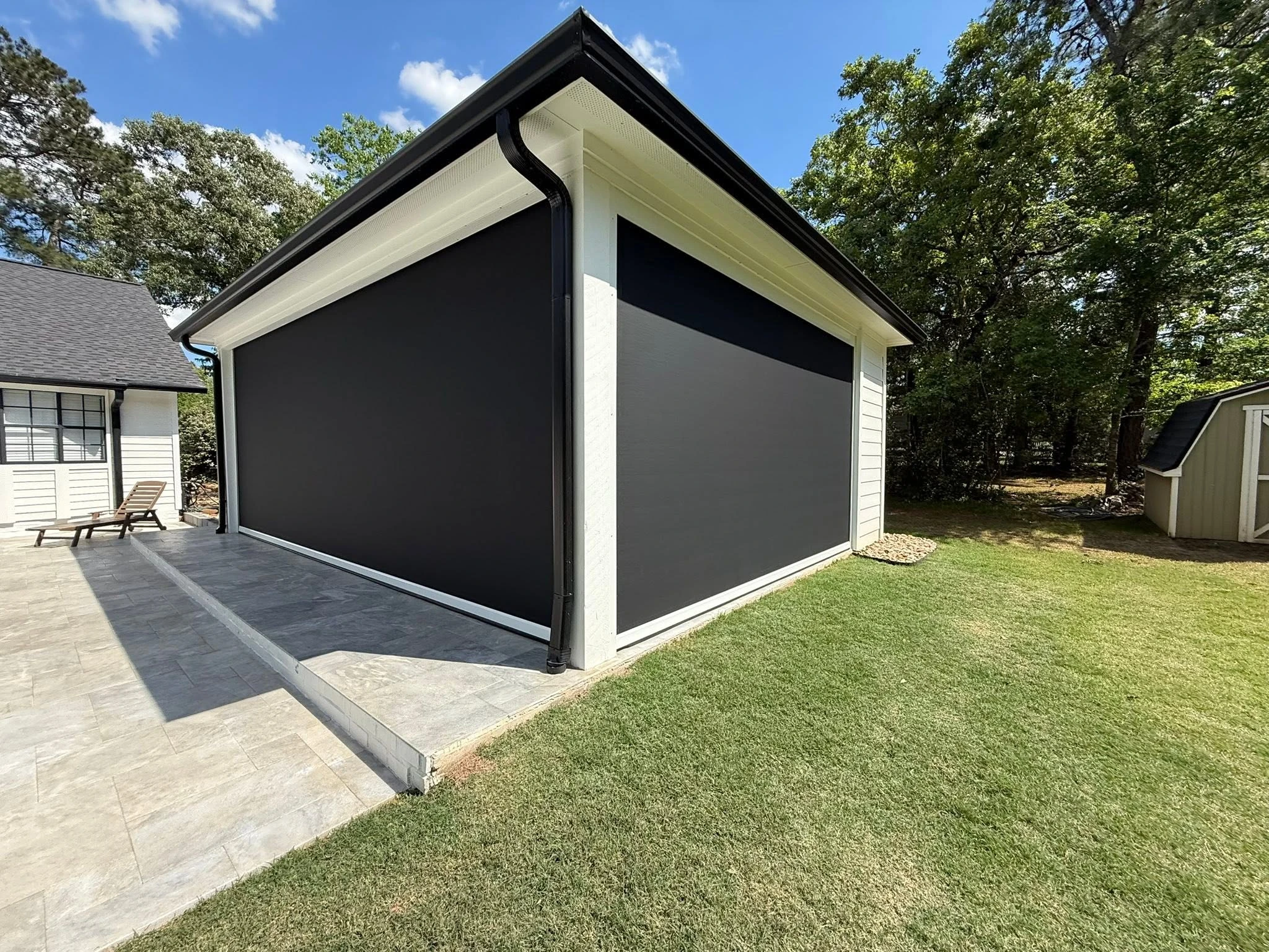 Patio shade system installed on a Houston backyard
