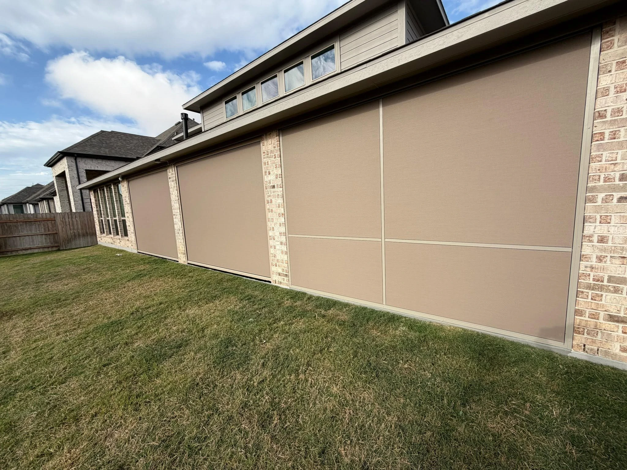 Covered patio enclosed with a custom shade system