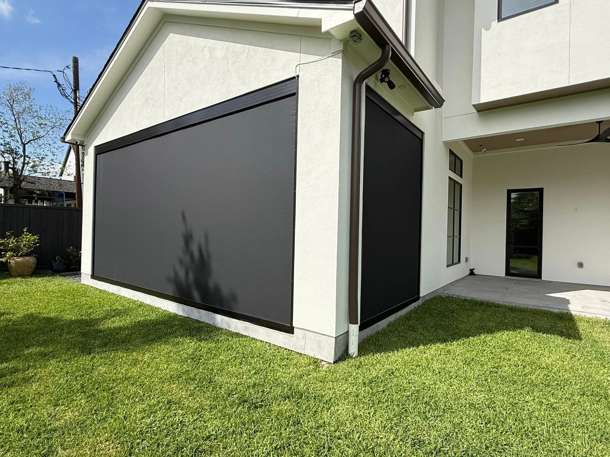 Patio shade system installed on a Houston backyard
