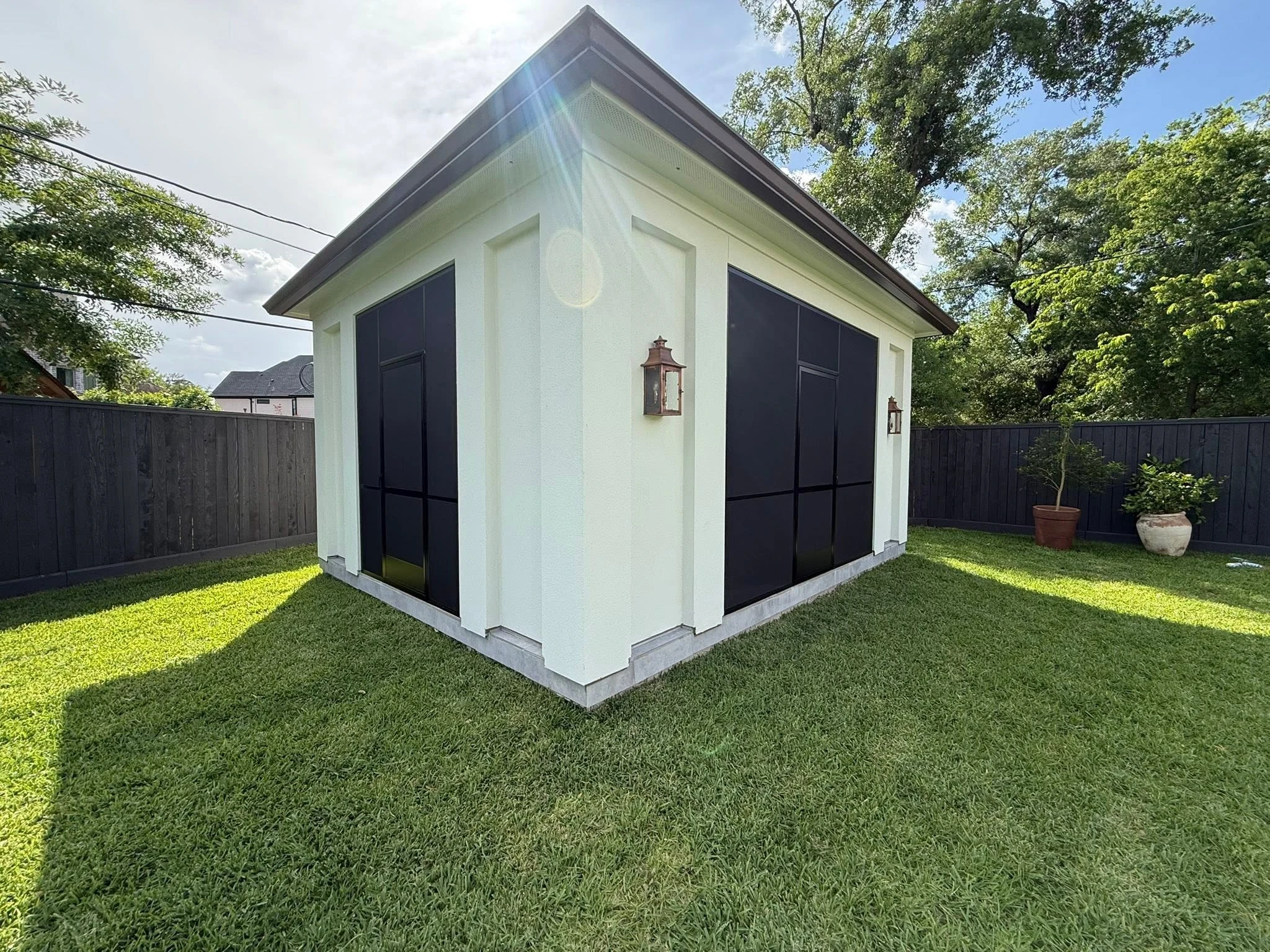 Motorized shade lowered over a Houston patio