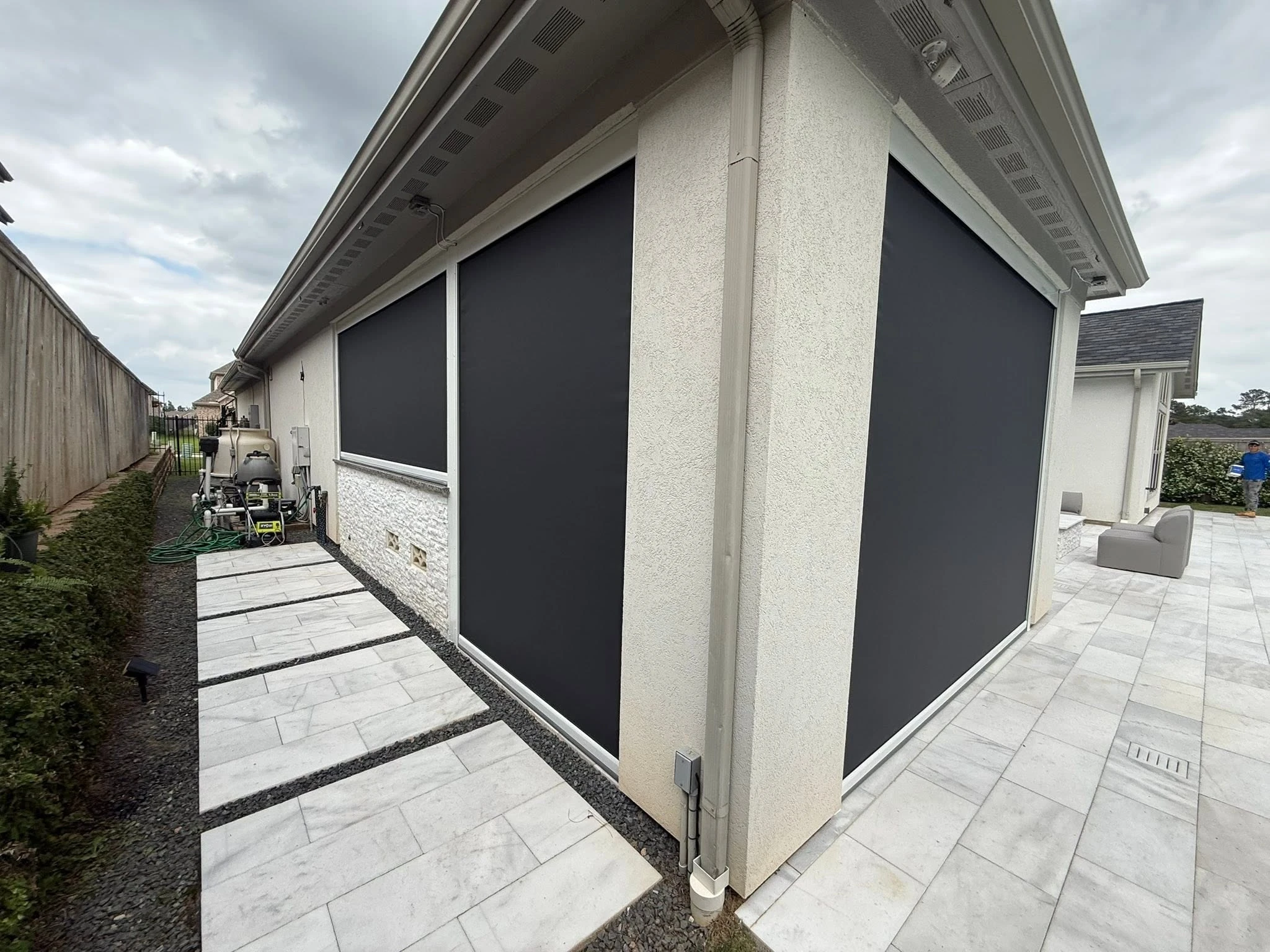 Covered patio enclosed with a custom shade system