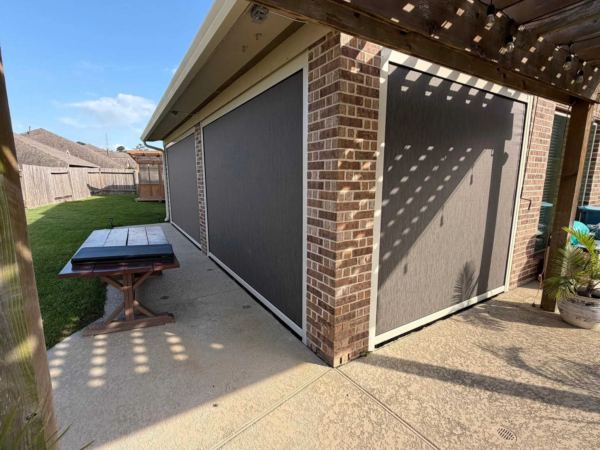 Custom motorized patio screen installation in Houston