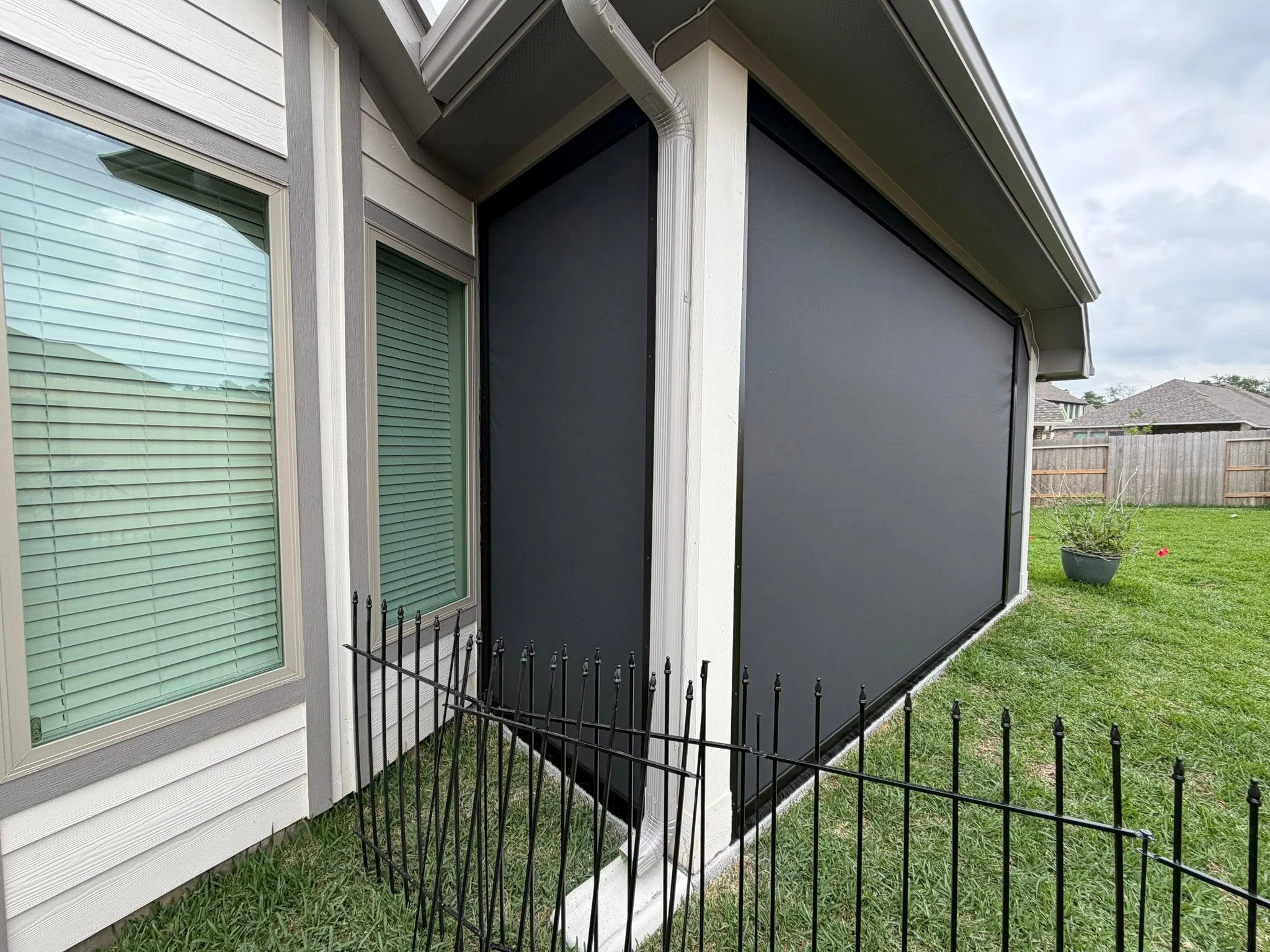 Patio shade system installed on a Houston backyard