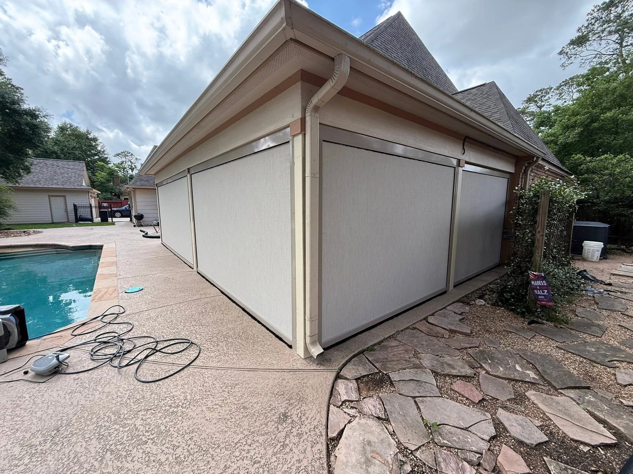 Patio shade system installed on a Houston backyard
