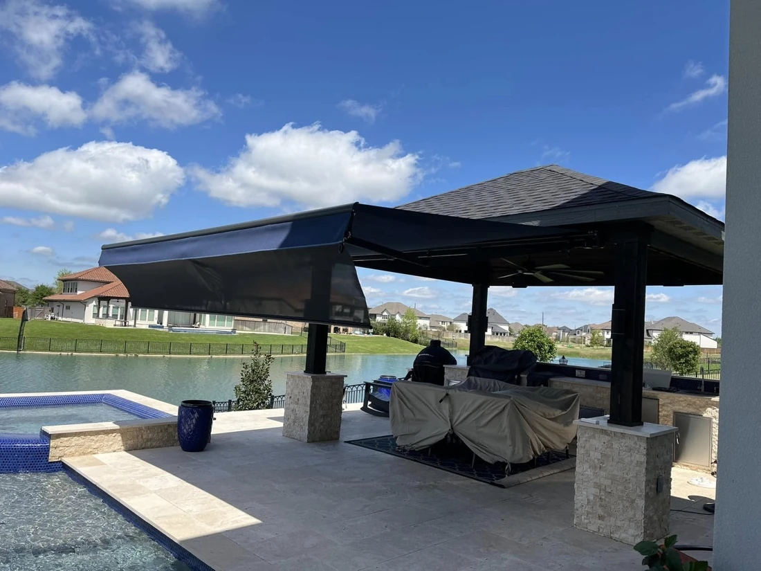 Motorized retractable awning extended over a Houston patio