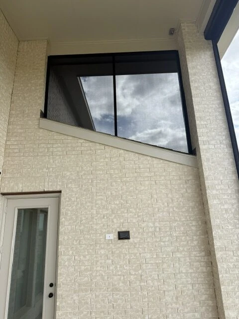 Custom fixed patio enclosure on a Houston outdoor living space