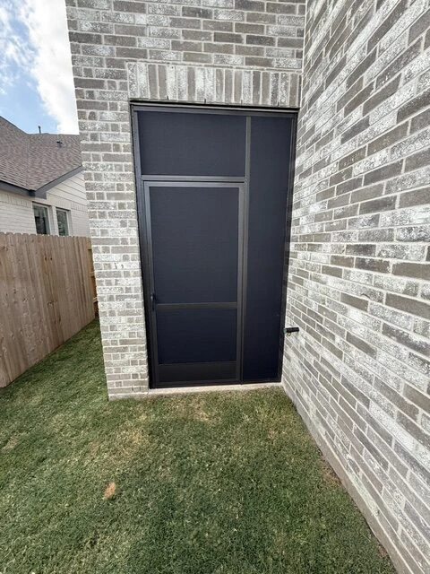 Fixed screen patio enclosure on a Houston home