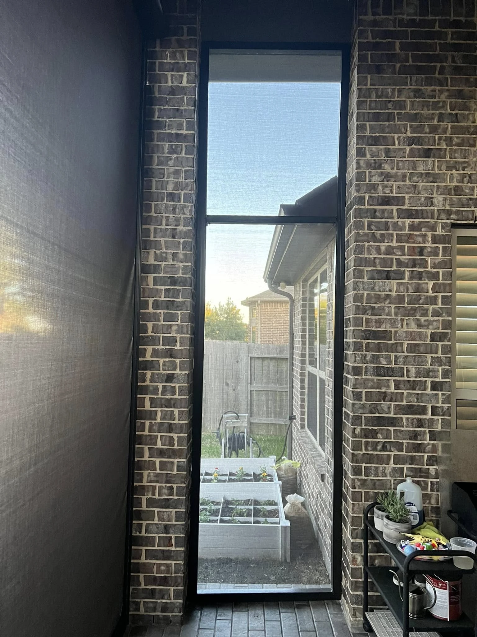 Screened patio enclosure protecting a Houston patio