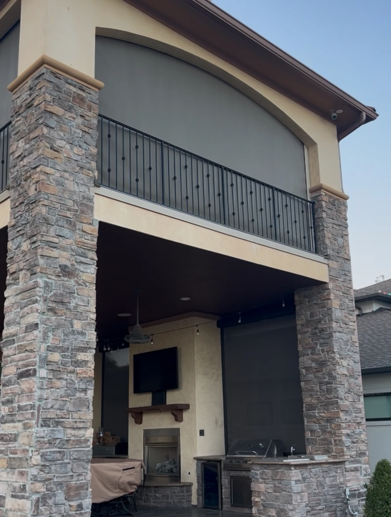 Hurricane shade lowered over a Houston outdoor living space