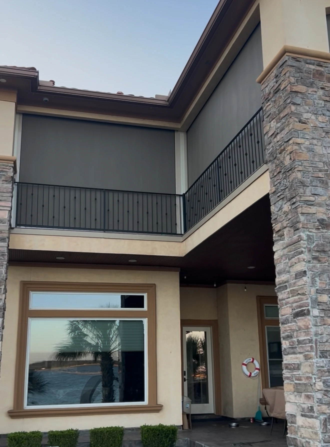 Custom hurricane shades on a Houston home