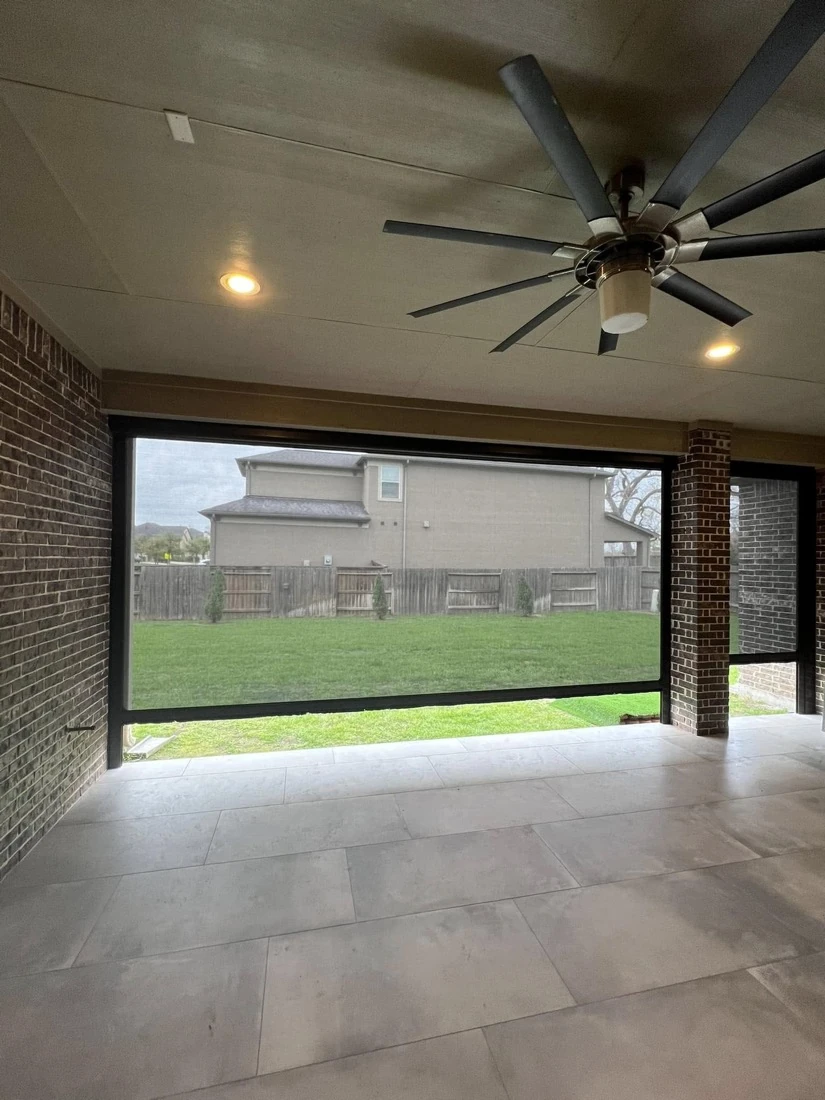 Outdoor living room with a retractable motorized screen