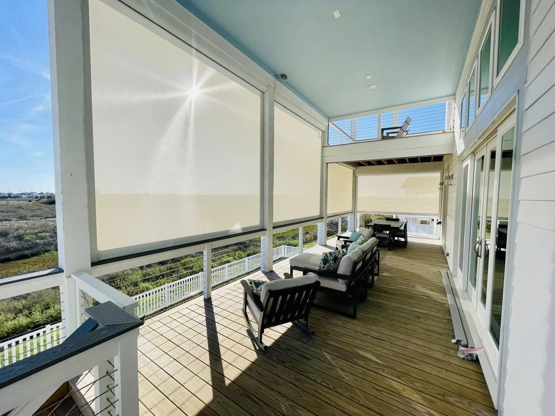 Motorized patio screens on a modern covered porch