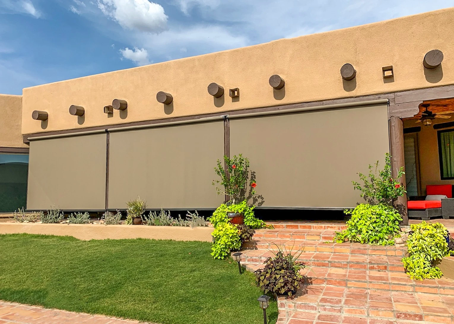 Open roller patio shade on a Houston patio